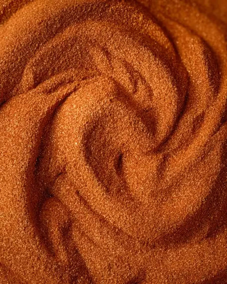 Close-up swirl of rich cocoa powder with fine texture.