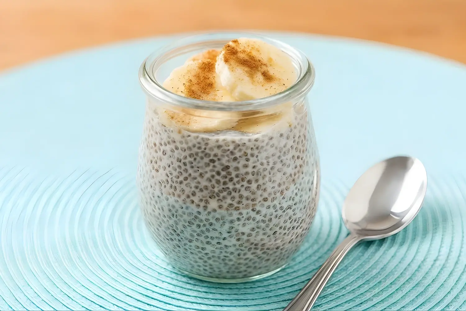 Colorful fruit salad with jelly cubes, including orange slices, raspberries, blackberries, blueberries, and kiwi.