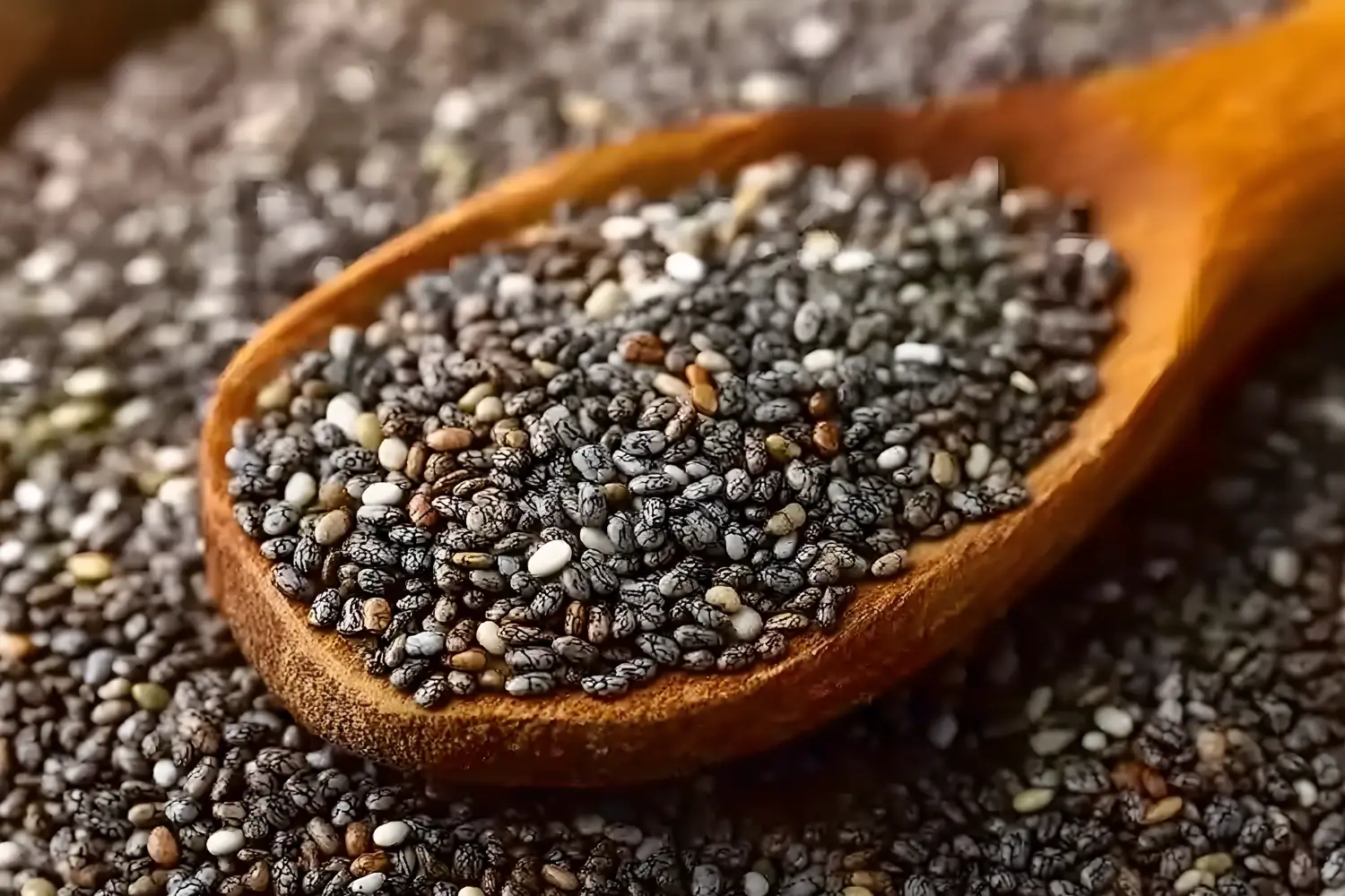 Chia seeds on a wooden spoon representing chia seeds before bed for weight loss and nighttime fullness