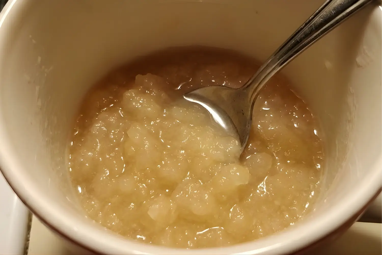 Prepared gelatin mixture for viral weight loss recipe with spoon, showing soft gel texture